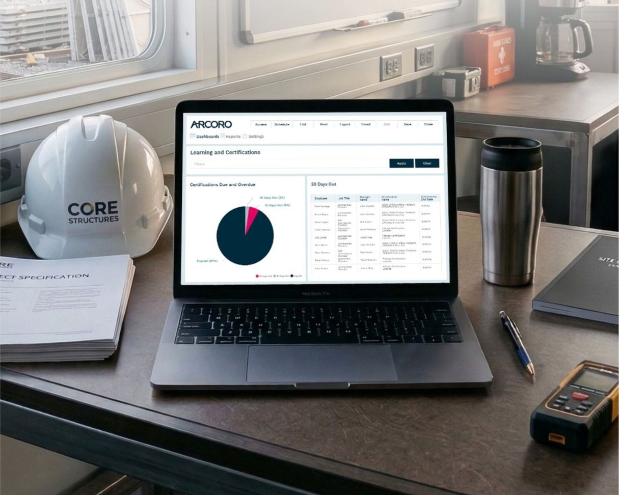 Laptop on construction jobsite desk.