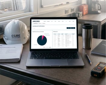 Laptop on construction jobsite desk.